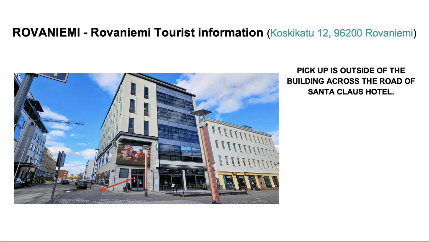 Modern buildings on a street in Rovaniemi with an arrow pointing to a pedestrian area and a note about pick up outside across from Santa Claus Hotel.