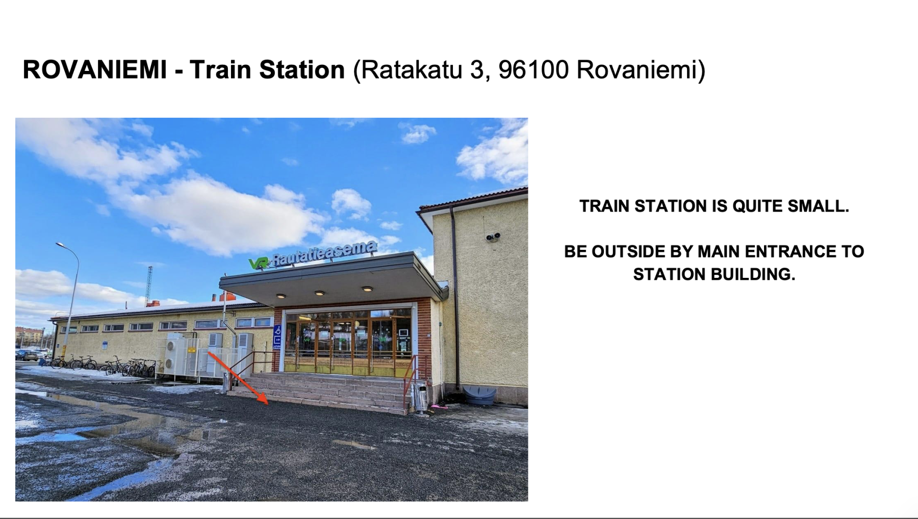 Exterior view of the small Rovaniemi train station building with steps leading to main entrance under a blue sky.